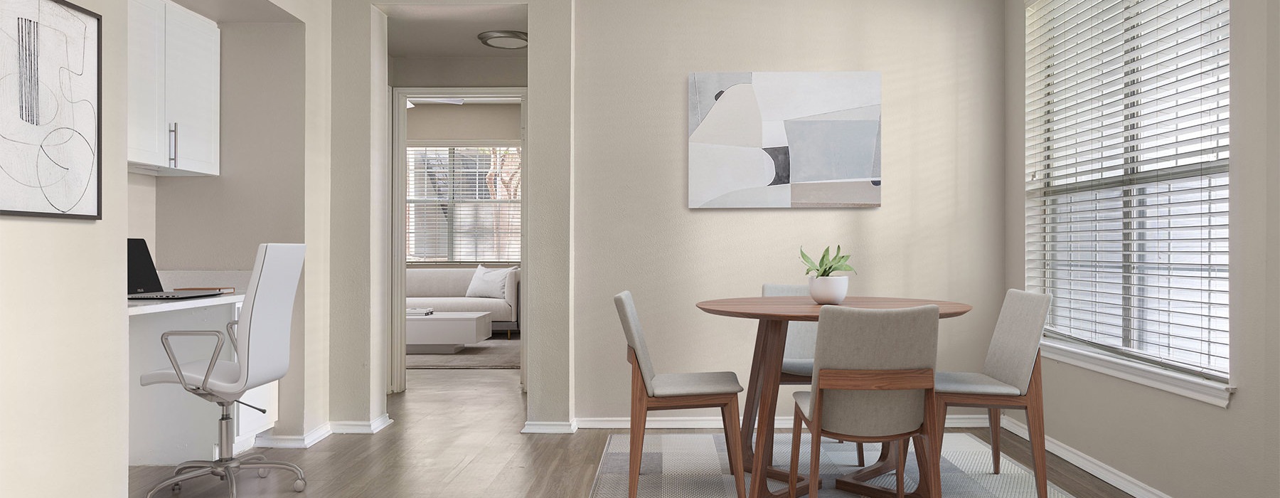 a dining room with a table and chairs