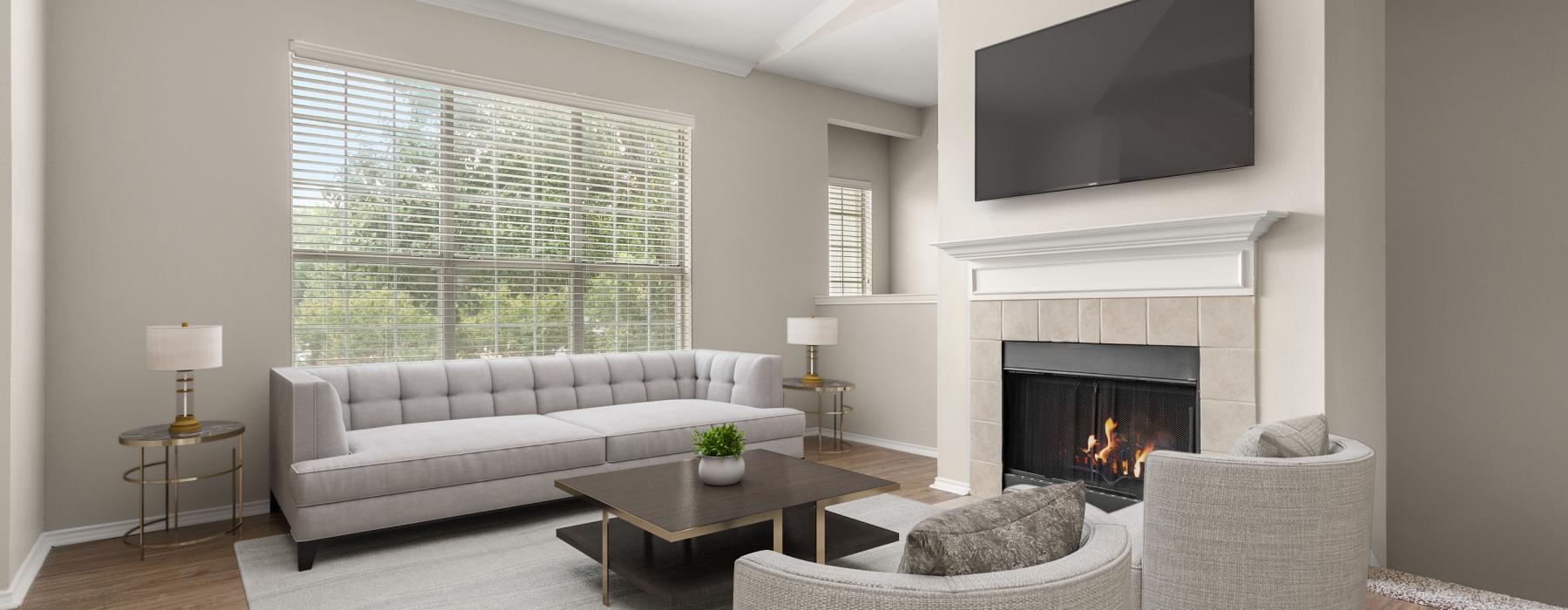 a living room with a fireplace and tv